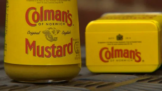 Colman’s Mustard jar and tin in signature bright yellow packaging with red lettering