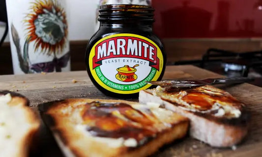 Jar of Marmite on toast with a small UK flag, captioned “Love it or hate it, it’s a true British classic.