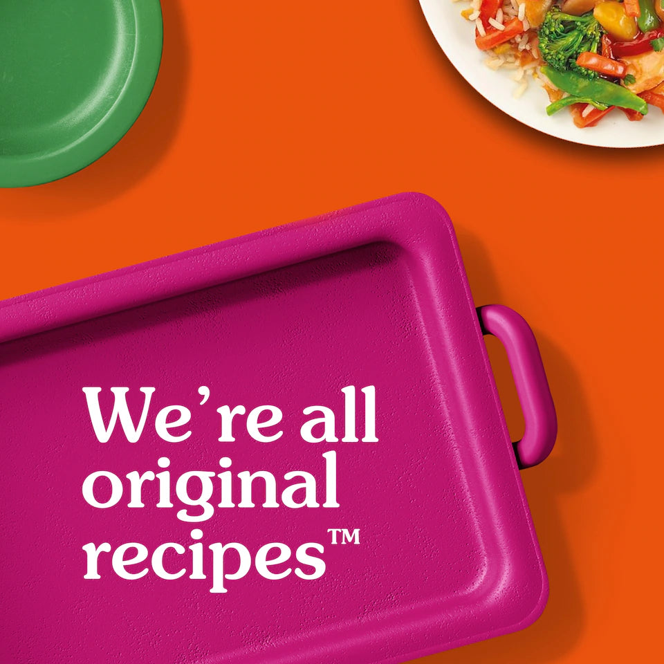 Pink tray with 'We're all original recipes' text on an orange background with a plate of food.
