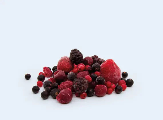 Assorted frozen berries on a white background