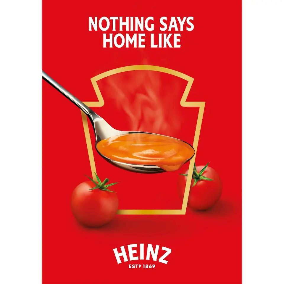 Heinz ketchup advertisement with a spoonful of ketchup and tomatoes on a red background