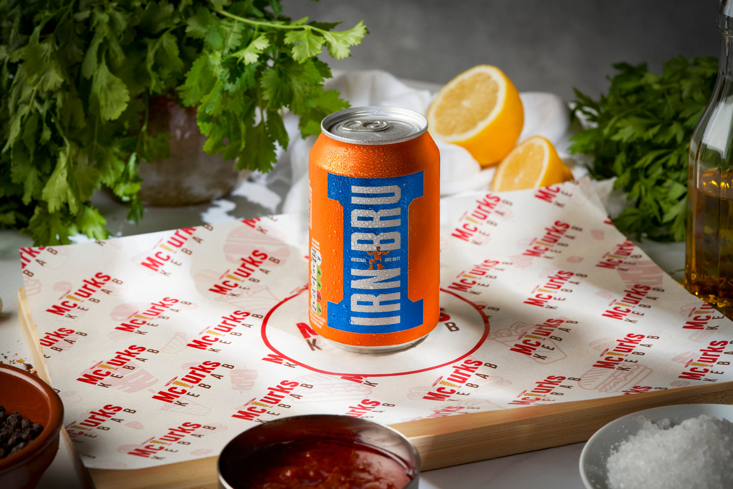 Lirik Bru can on a McVitie's branded paper with lemon slices and herbs in the background