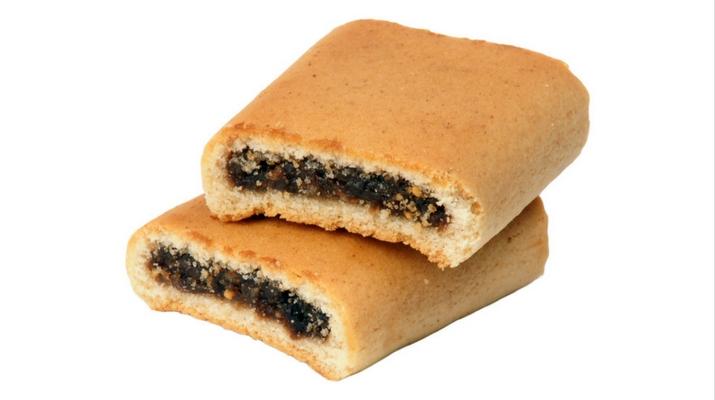 Two sandwich cookies with a filling on a white background