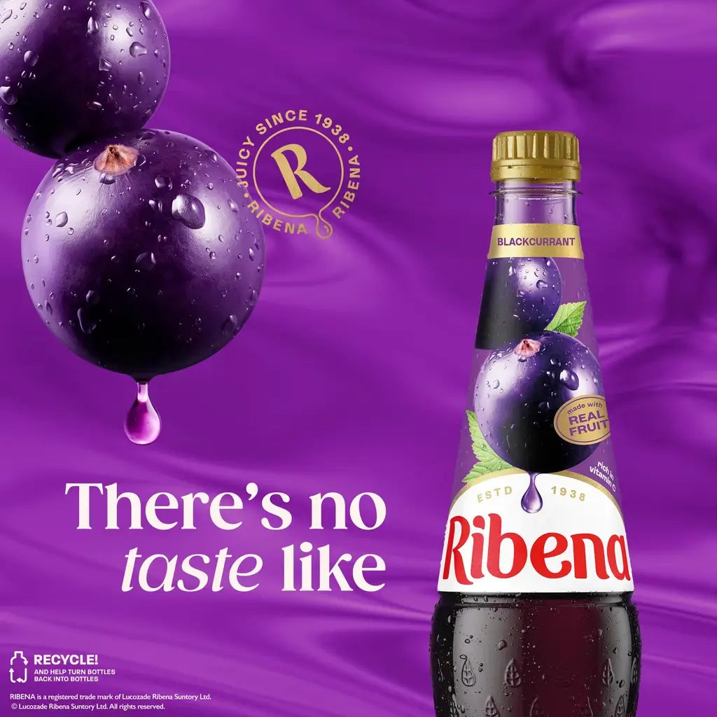 Ribena bottle with blackcurrant fruit on a purple background