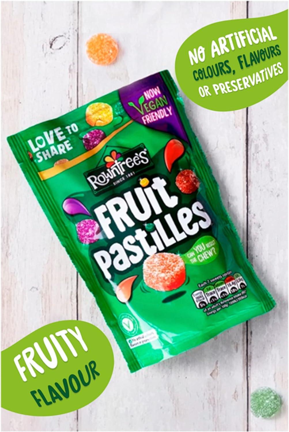 Rowntree's Fruit Pastilles packaging on a wooden surface with decorative elements.