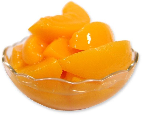 Glass bowl filled with sliced peaches on a white background