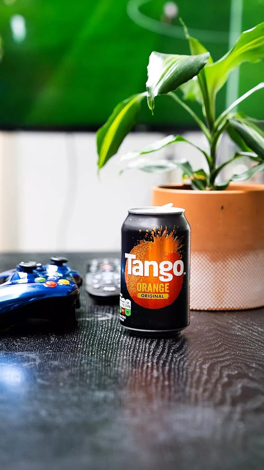 Tango Orange can on a table with a blurred background