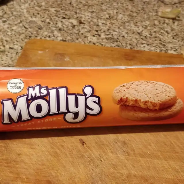 Packaging of Ms Molly's cookies on a wooden surface