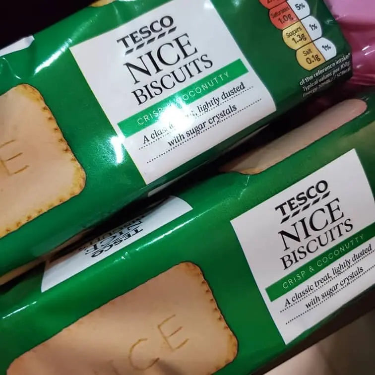 Two packages of Tesco Nice Biscuits with green and white packaging.