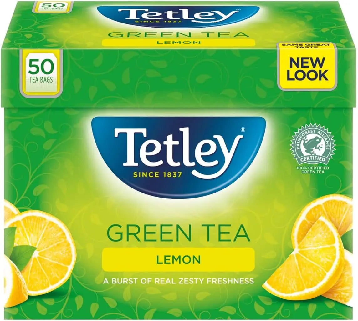Box of Tetley Green Tea Lemon with lemon slices on a green background