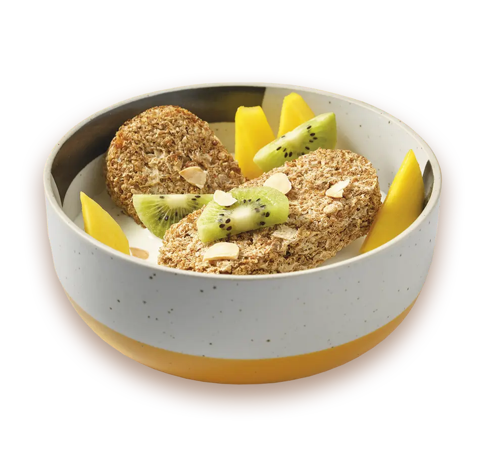 Bowl with oatmeal, kiwi, and pineapple on a white background