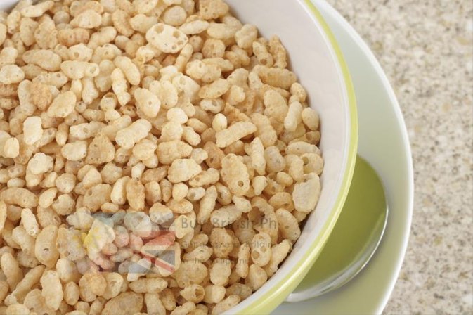Close-up of a bowl filled with cereal on a textured surface