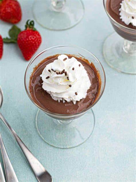 British chocolate pudding served in a glass with whipped cream