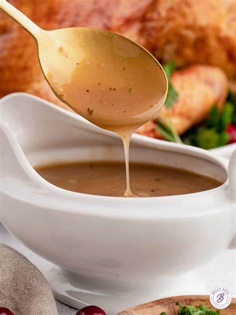 British gravy being poured into a gravy boat, served with a traditional roast dinner