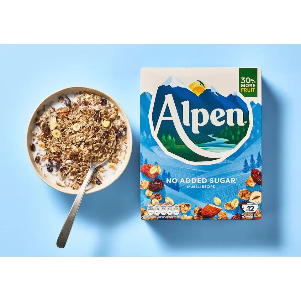 Alpen cereal box with a bowl of cereal on a blue background