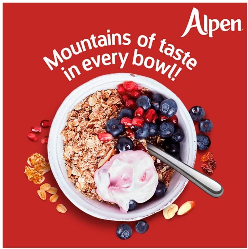 Bowl of granola with yogurt and berries on a red background with Alpen branding.