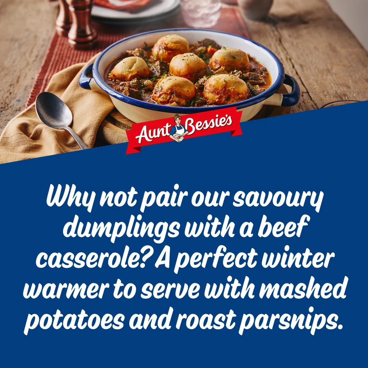 Bowl of savoury dumplings with beef casserole on a wooden table, featuring Aunt Bessies branding.