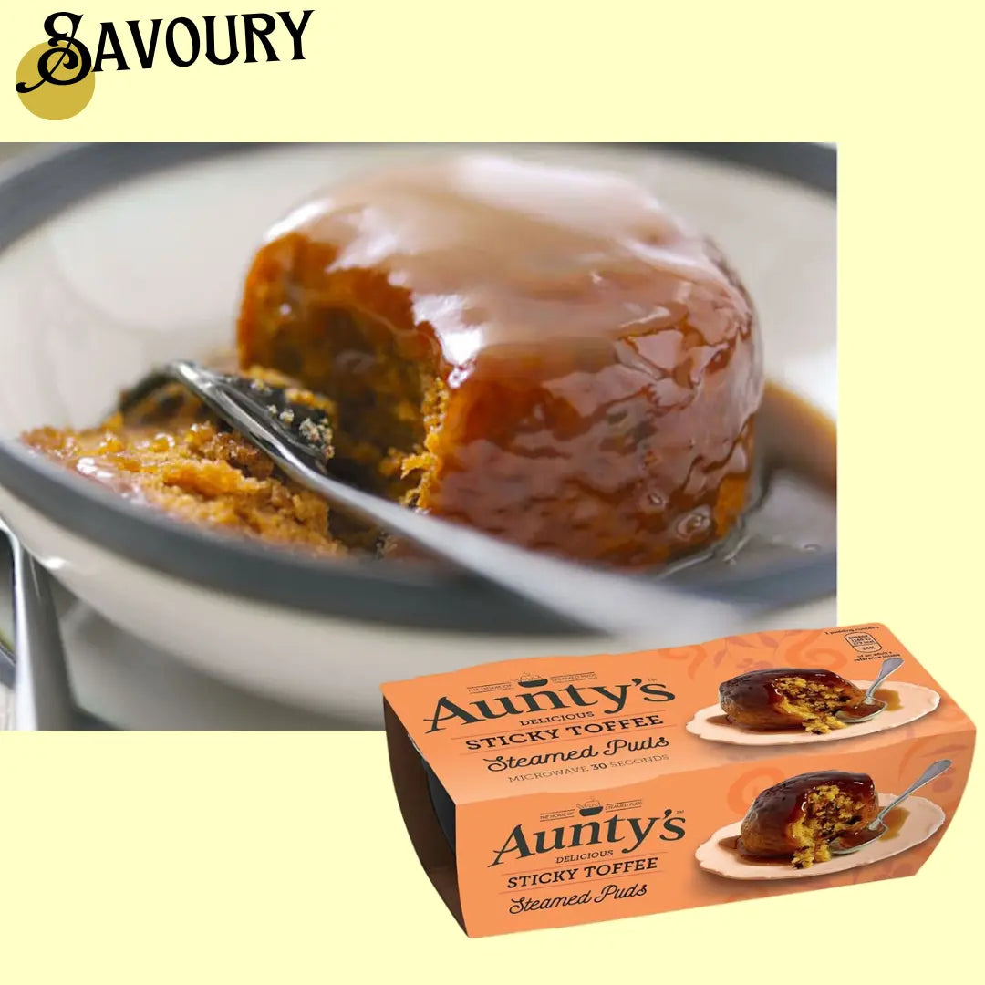 Sticky toffee pudding with a spoon and Aunty's Sticky Toffee Pudding packaging on a light yellow background.