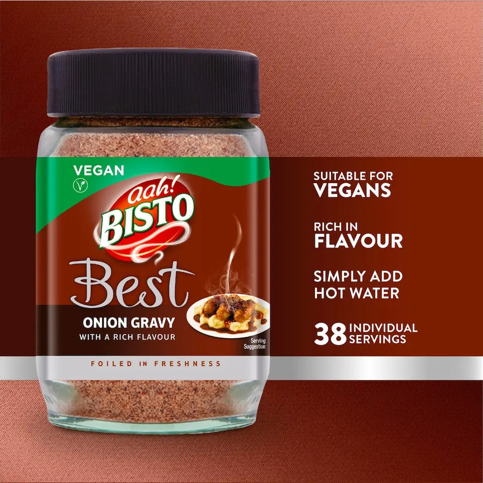 A jar of Bisto Best Onion Gravy vegan food product on a textured brown background, with text highlighting its vegan suitability, rich flavor, and 38 individual servings.