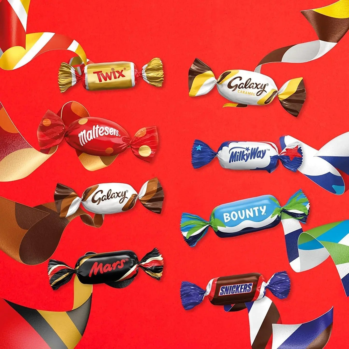 Assorted candy bars on a red background