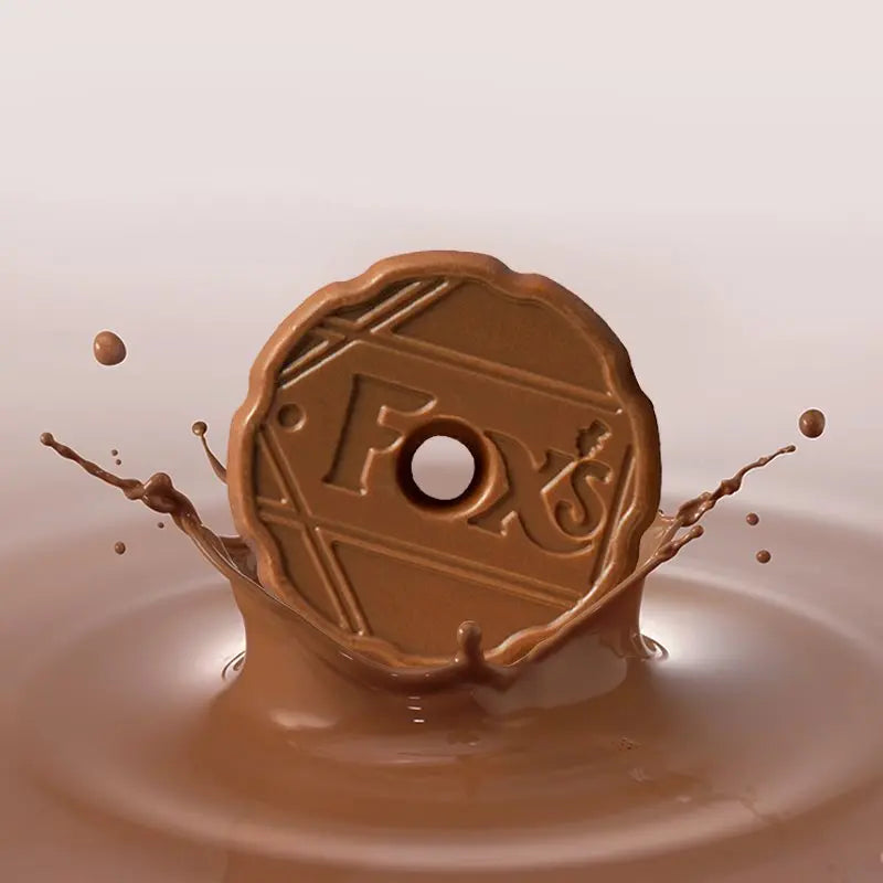 Chocolate coin with 'Fox' branding splashing into milk chocolate