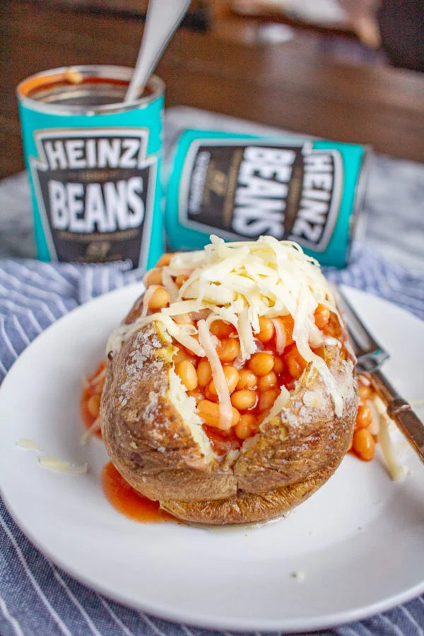 Heinz Baked Beans in a Rich Tomato Sauce on a Jacket Potato with Cheese topping.