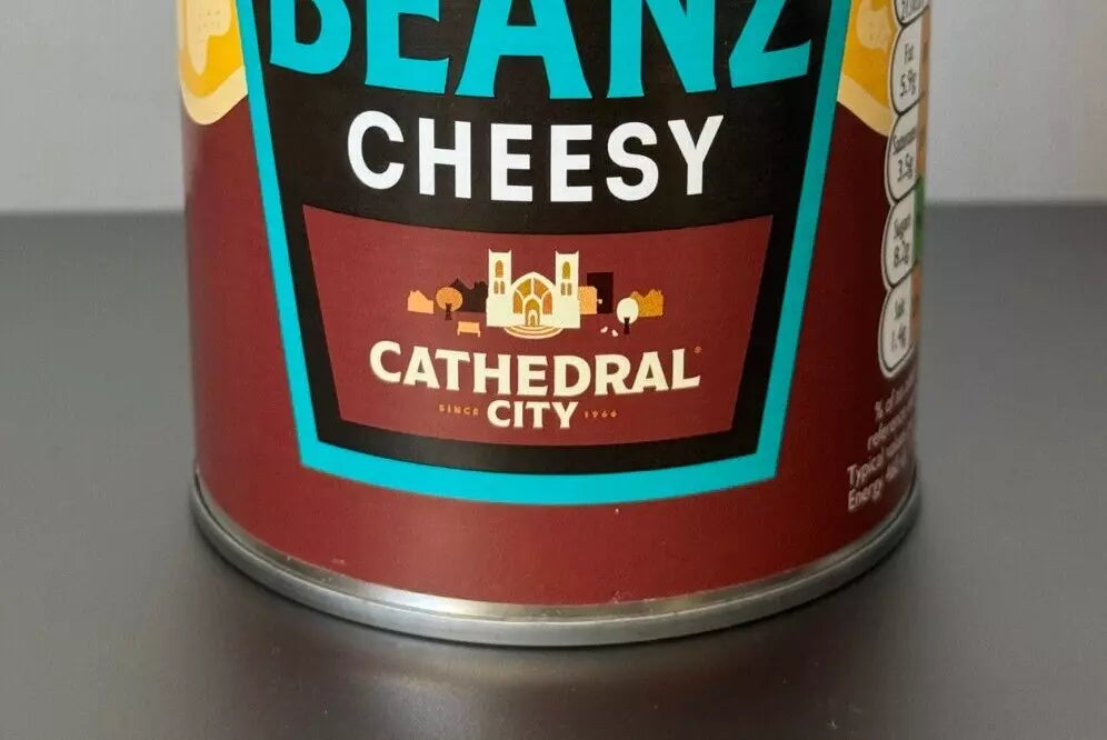 Can of Cathedral City Cheesy Beans on a gray surface