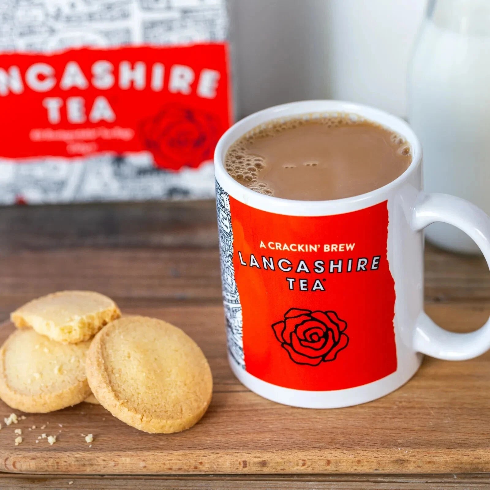 Lancashire Tea mug with cookies on a wooden surface