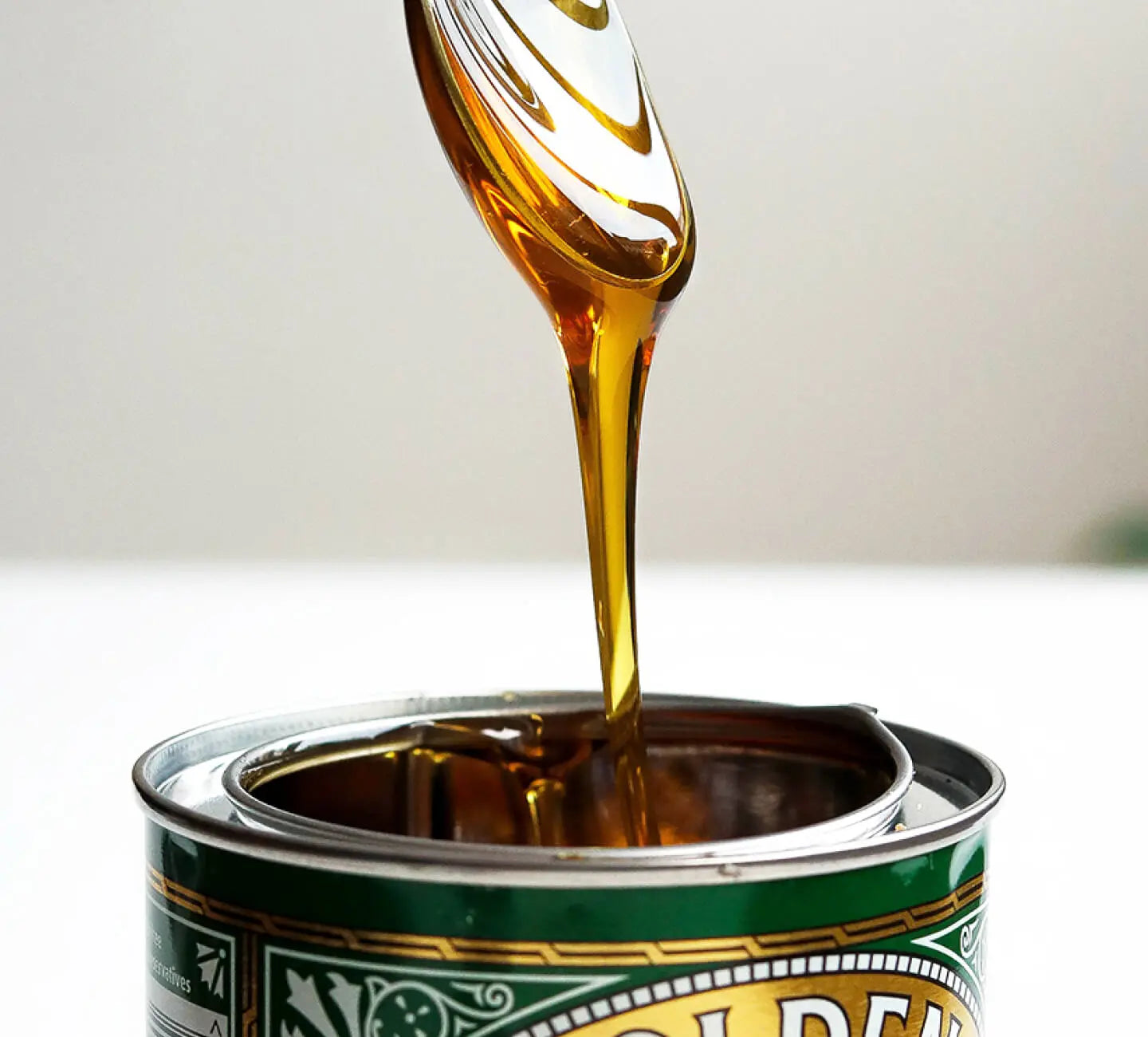 Goldenseal tincture being poured from a dropper into a can.