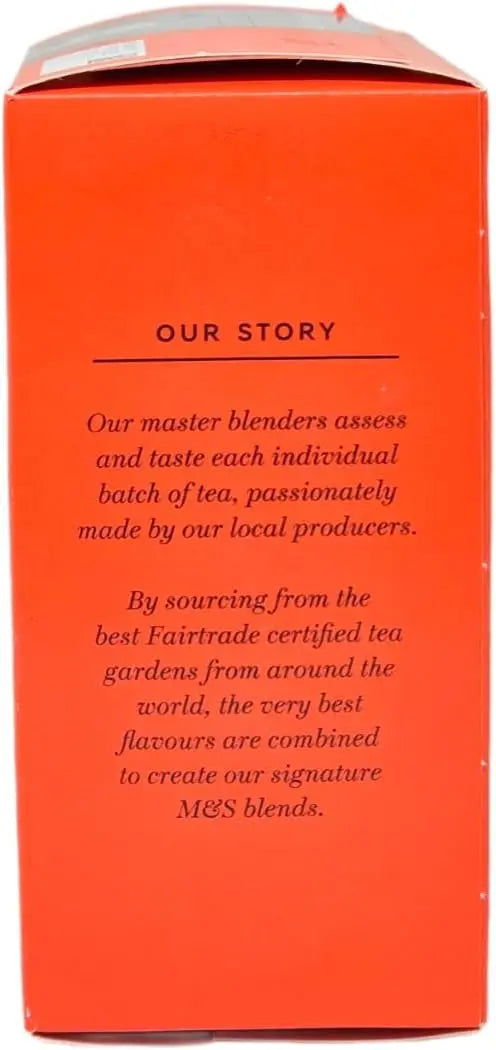 Orange tea box with black text detailing the tea-making process and sourcing information.