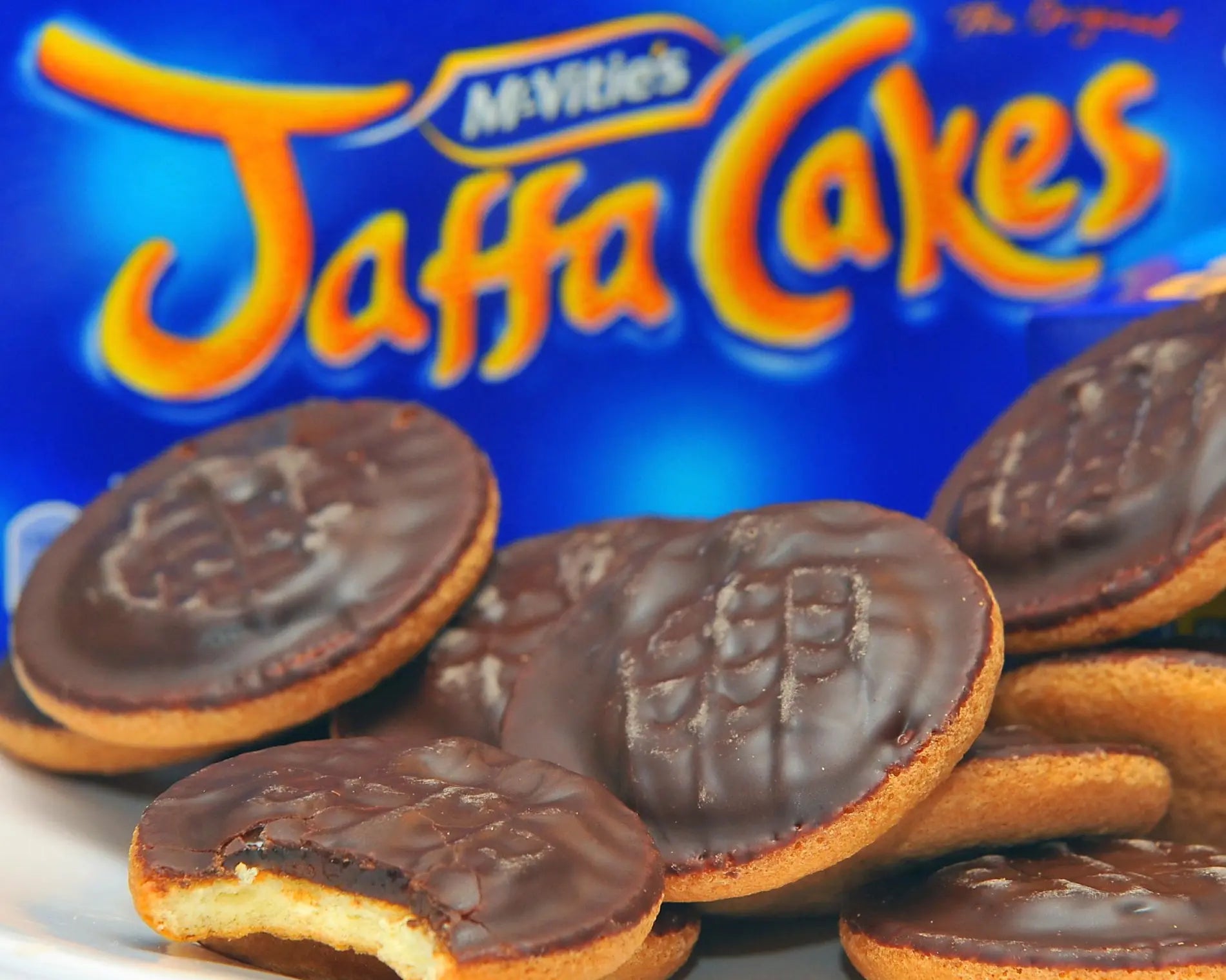 Jaffa Cakes with chocolate topping on a blue background