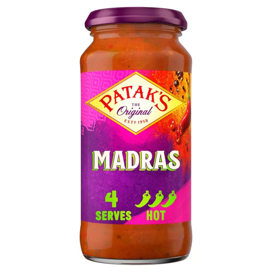 Jar of Pataks Madras sauce with a colorful label on a white background