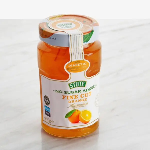 Jar of Stute no sugar added fine cut orange marmalade on a white background