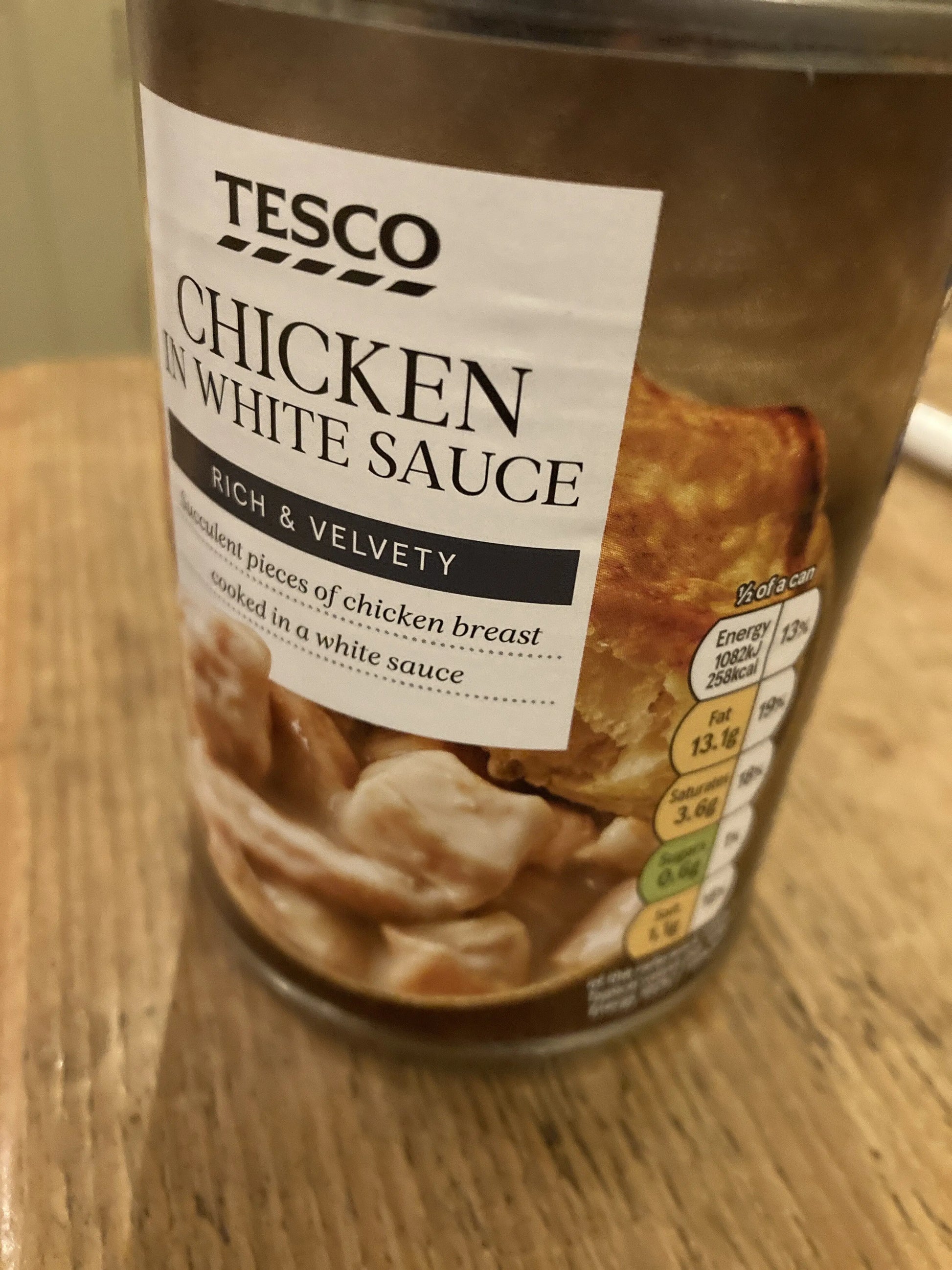 Jar of Tesco Chicken in White Sauce on a wooden surface