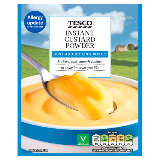 Tesco Instant Custard Powder packaging with a spoonful of custard and scenic background