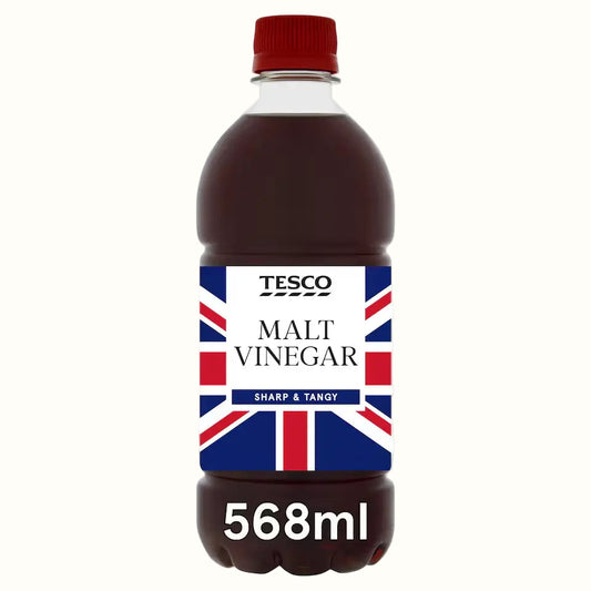 Bottle of Tesco Malt Vinegar with a Union Jack label on a white background