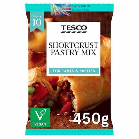 Tesco shortcrust pastry mix packaging with images of tarts and pasties on a white background.