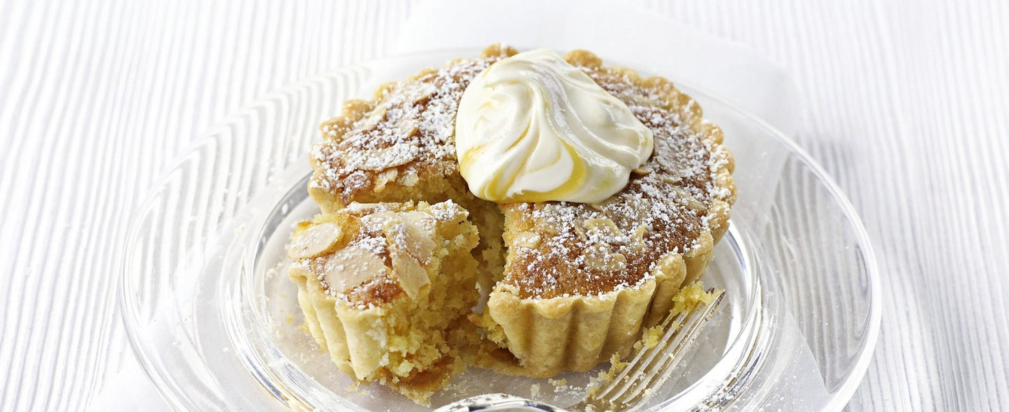 Pastry with whipped cream on a white plate