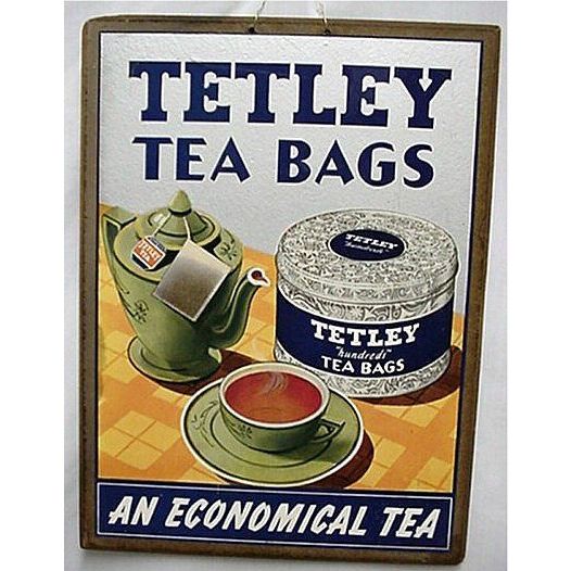 Vintage-style advertisement for Tetley tea bags featuring a teapot, cup, and tea canister.