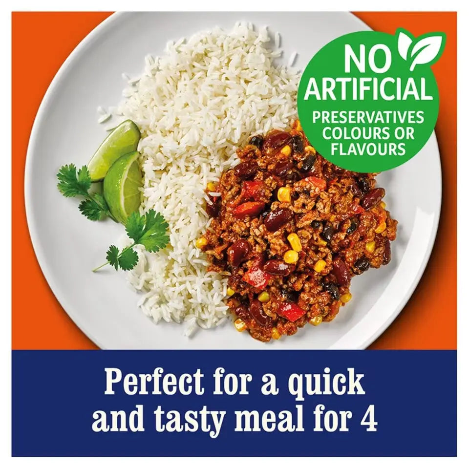 Plate of rice and meat dish with lime wedges and cilantro, labeled 'No Artificial Preservatives'.